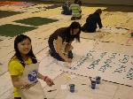 Volunteers paint signs